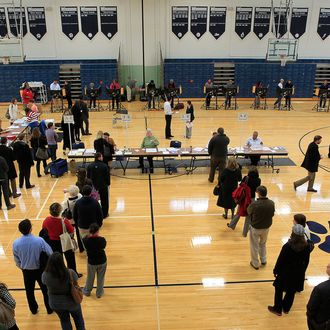 Voters stand on line at the polls November 6, 2012 in Columbus, Ohio. U.S. citizens go to the polls today to vote in the election between Democratic President Barack Obama and Republican nominee former Massachusetts Gov. Mitt Romney. 