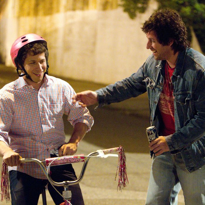 Donny Berger (Adam Sandler) teaching Todd Peterson (Andy Samberg) to ride a bike in Columbia Pictures' comedy THAT'S MY BOY.