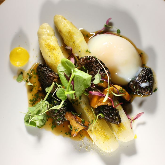 At Aldea, George Mendes pairs morels with white asparagus and a soft-poached hen egg.