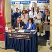 Gov. Kathy Hochul signs the Safe Harbor for All legislation alongside Health Commissioner James McDonald, at Albany Health Center in Albany, N.Y., on Tuesday, March 19, 2024. (Cindy Schultz/The New York Times)