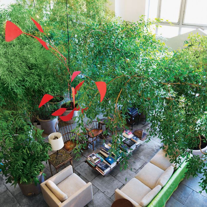 A Calder mobile hangs above the lush living room.