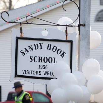 Police guard the entrance to the Sandy Hook School on December 15, 2012 in Newtown, Connecticut. The residents of an idyllic Connecticut town were reeling in horror from the massacre of 20 small children and six adults in one of the worst school shootings in US history. The heavily armed gunman shot dead 18 children inside Sandy Hook Elementary School, said Connecticut State Police spokesman Lieutenant Paul Vance. Two more died of their wounds in hospital.