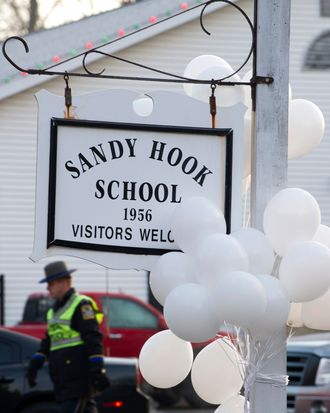 Police guard the entrance to the Sandy Hook School on December 15, 2012 in Newtown, Connecticut. The residents of an idyllic Connecticut town were reeling in horror from the massacre of 20 small children and six adults in one of the worst school shootings in US history. The heavily armed gunman shot dead 18 children inside Sandy Hook Elementary School, said Connecticut State Police spokesman Lieutenant Paul Vance. Two more died of their wounds in hospital.