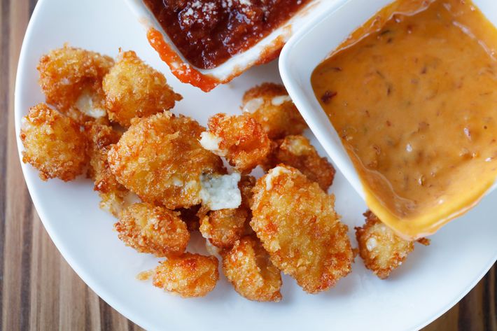 Fried cheese curds with tomato sauce and "Sammy" sauce.