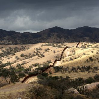  The U.S.-Mexico border fence stretches into the countryside on March 8, 2013 near Nogales, Arizona. U.S. Border Patrol agents in Nogales say they have seen a spike in immigrants crossing into the United States from Mexico in the last week. 