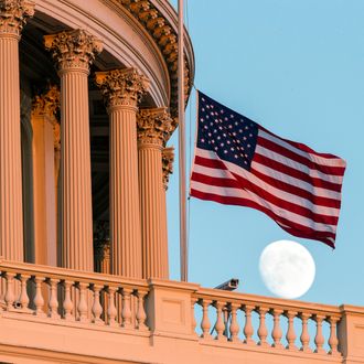 The American flag flies at half-staff over the U.S. Capitol at sunset following the shooting at the Washington Navy Yard, Monday, Sept. 16, 2013, in Washington. (AP Photo/J. Scott Applewhite)