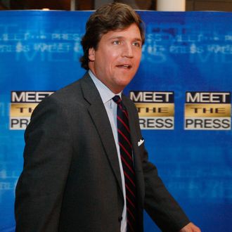 Tucker Carlson arrives for the 60th anniversary celebration of NBC's Meet the Press at the Newseum in Washington.