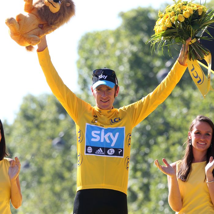 Bradley Wiggins of Great Britain and Sky Procycling receives the last yellow jersey during the trophy ceremony, after the twentieth and final stage of the 2012 Tour de France, from Rambouillet to the Champs-Elysees on July 22, 2012 in Paris, France