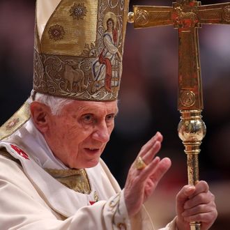 Pope Benedict XVI waves to the faithful as he arrives at the St. Peter's Basilica for a mass with newly appointed cardinals on November 25, 2012 in Vatican City, Vatican.