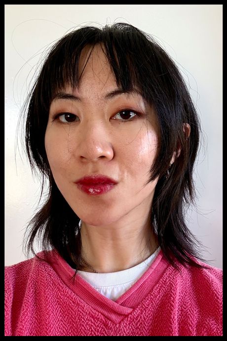 Author wearing Glossier's Ultralip in Flute.