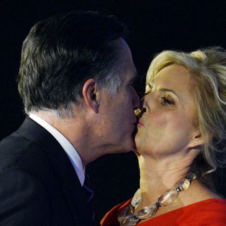 US Republican presidential candidate Mitt Romney kisses his wife Ann after conceding defeat to President Barack Obama on November 7, 2012 in Boston. Obama swept to re-election, forging history again by transcending a slow economic recovery and the high unemployment which haunted his first term to beat Romney. 