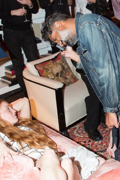 Ruvan Wijesooriya taking a model's photo at Glenn O'Brien's TV party at Casa Claridge.