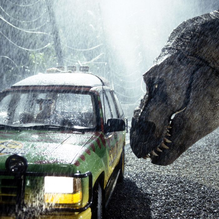 A tyrannosaurus rex terrorizes people trapped in a car in a scene from the 1993 American film Jurassic Park directed by Steven Spielberg. The sci-fi adventure stars Sam Neill, Laura Dern, and Jeff Goldblum. The film is an adaptation of Michael Crichton's novel of the same name.