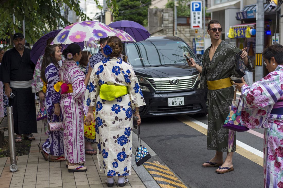 Tourists dressed in traditional Japanese kimonos in Kyoto, Japan.