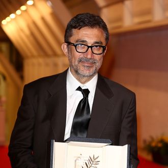 CANNES, FRANCE - MAY 24: Director Nuri Bilge Ceylan poses with the Palme d'Or for his film 'Winter's Sleeps' during the Palme D'Or Winners dinner during the 67th Annual Cannes Film Festival on May 24, 2014 in Cannes, France. (Photo by Tim P. Whitby/Getty Images)