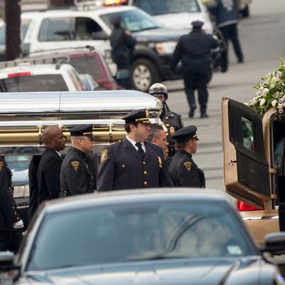 NEWARK, NJ - FEBRUARY 18: Pallbearers carry the casket of Whitney Houston to a hearse outside New Hope Baptist Church after funeral services on February 18, 2012 in Newark, New Jersey. Whitney Houston was found dead in her hotel room at The Beverly Hilton hotel on February 11, 2012. (Photo by Michael Nagle/Getty Images)