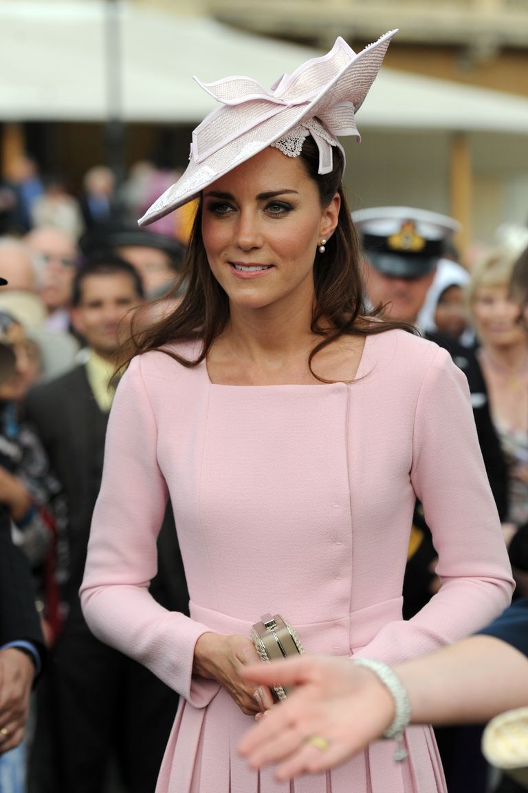 LONDON, UNITED KINGDOM - MAY 29:  Catherine, Duchess of Cambridge meets guests during a garden party at Buckingham Palace on May 29, 2012 in London, England. (Photo by Anthony Devlin - WPA Pool /Getty Images)