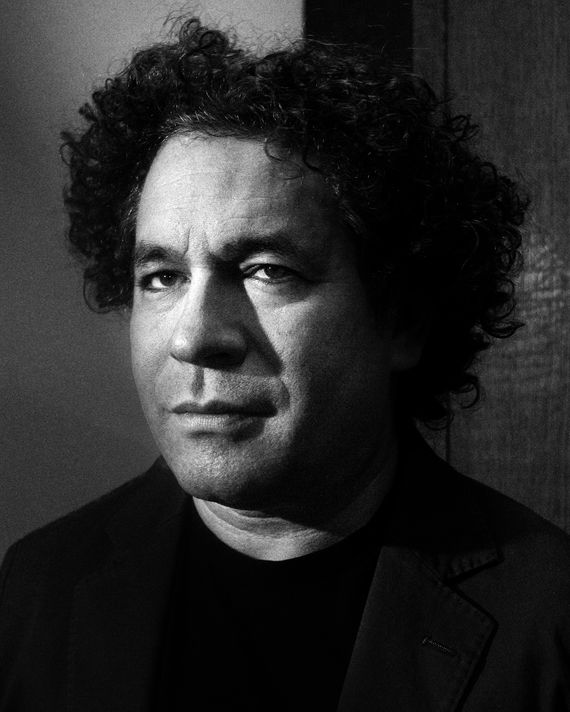 Gustavo Dudamel leading an orchestra with intense focus and emotion