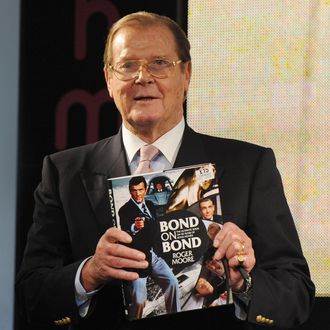 LONDON, UNITED KINGDOM - OCTOBER 22: Sir Roger Moore meets fans and signs copies of his book 'Bond on Bond' at HMV, Oxford Street on October 22, 2012 in London, England. (Photo by Stuart Wilson/Getty Images)