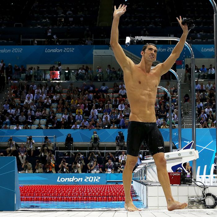 Michael Phelps of the United States celebrates winning the Men?s 100m Butterfly Final as he exits the pool on Day 7 of the London 2012 Olympic Games at the Aquatics Centre on August 3, 2012 in London, England.