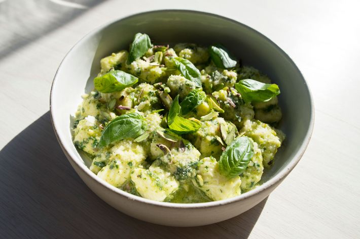 Ricotta gnocchi with broccoli pesto and pistachios.