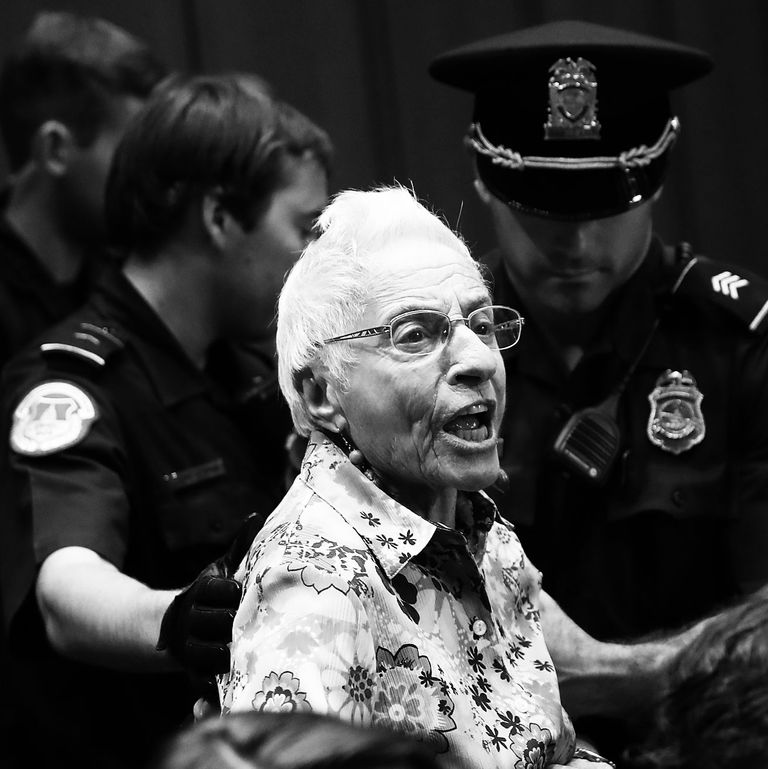 Protester being thrown out of Kavanaugh hearings on the second day.