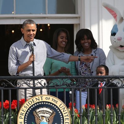 WASHINGTON, DC - APRIL 01: U.S. President Barack Obama speaks while flanked by his daughters Sasha (L), Malia, first lady Michelle Obama, Robby Novak and the Easter Bunny, during the annual Easter Egg Roll on the White House tennis court April 1, 2013 in Washington, DC. Thousands of people are expected to attend the 134-year-old tradition of rolling colored eggs down the White House lawn that was started by President Rutherford B. Hayes in 1878. (Photo by Mark Wilson/Getty Images)