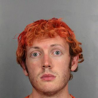 CENTENNIAL, CO - UNSPECIFIED DATE: In this handout provided by the Arapahoe County Sheriff's Office, accused movie theater shooter James Holmes poses for a booking photo on an unspecified date in Centennial, Colorado. According to police, Holmes killed 12 people and injured 58 others during a shooting rampage at an opening night screening of 