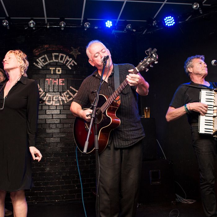 LEEDS, UNITED KINGDOM - AUGUST 06: Sally Timms, Jon Langford and Rico Bell of The Mekons perform on stage at Brudenell Social Club on August 6, 2014 in Leeds, United Kingdom. (Photo by Andrew Benge/Redferns via Getty Images)