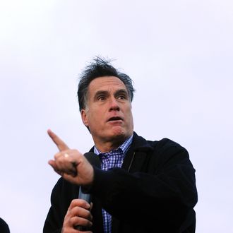 Republican presidential hopeful Mitt Romney speaks during a campaign rally outside a grocery store in Des Moines, Iowa, on December 30, 2001. Romney on Friday ripped President Barack Obama over his annual Hawaii vacation, painting him as out of touch with Americans' economic suffering. Romney was speaking at a rally four days before this heartland state holds its presidential nominating caucus, the first battle in the state-by-state fight to pick a Republican challenger to Obama in the November 2012 elections. AFP Photo/Jewel Samad (Photo credit should read JEWEL SAMAD/AFP/Getty Images)