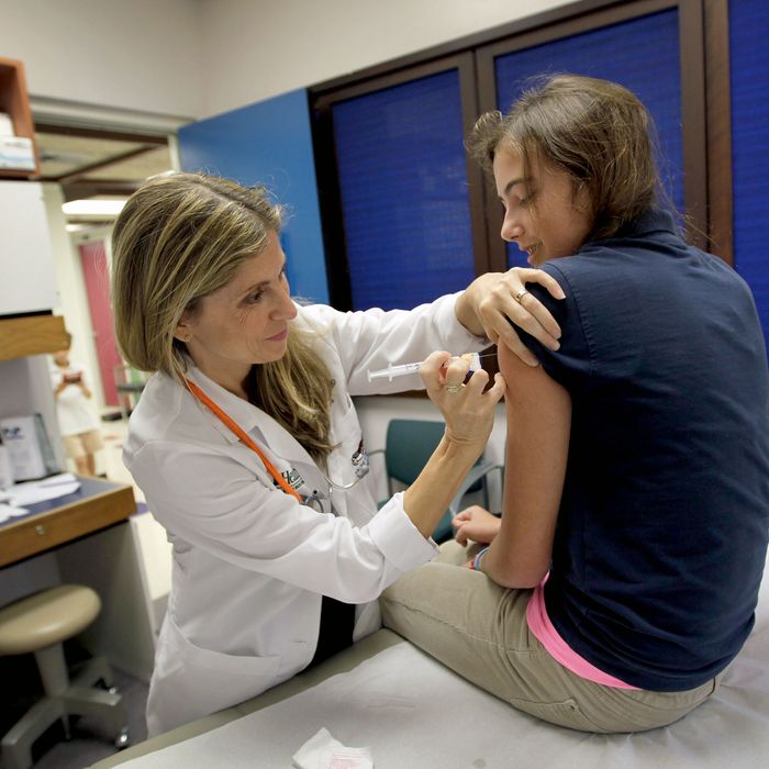 A girl gets the HPV vaccine.