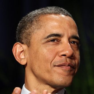 U.S. President Barack Obama applauds at the National Prayer Breakfast February 2, 2012 in Washington, DC. 