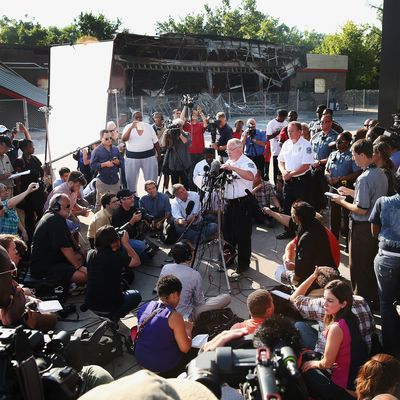 FERGUSON, MO - AUGUST 15: Standing in the parking lot of a gas station which was burned during rioting, Ferguson Police Chief Thomas Jackson announces the name of the Ferguson police officer responsible for the August 9, shooting death of teenager Michael Brown on August 15, 2014 in Ferguson, Missouri. The officer was identified as Darren Wilson, a six year veteran of the police department. Brown's killing sparked several days of violent protests in the city. (Photo by Scott Olson/Getty Images)