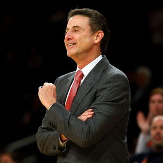 Head coach Rick Pitino of the Louisville Cardinals smiles against the Notre Dame Fighting Irish during the semifinals of the Big East Men's Basketball Tournament at Madison Square Garden on March 15, 2013 in New York City.