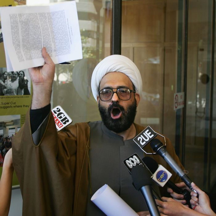  A picture made available 15 December 2014 shows muslim cleric Man Haron Monis speaking to the media after leaving Downing Centre Local Court after he had been charged with seven counts of unlawfully using the postal service to menace, after sending harassing letters to families of Australian soldiers, in Sydney, Australia, 10 November 2009. According to news reports on 15 December 2014 citing police, Man Haron Monis has allegedly been identified by police as the hostage-taker at a cafe in downtown Sydney, Australia. A number of hostages were being held inside a Lindt cafe, after witnesses reported gunshots and footage showed an Islamist flag held up to the window. EPA/SERGIO DIONISIO AUSTRALIA AND NEW ZEALAND OUT