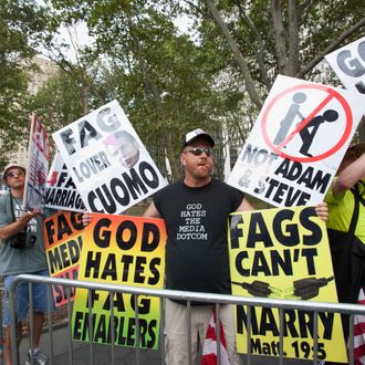 NEW YORK, NY - JULY 24: Anti Gay marriage protesters from the Westboro Baptist Church attend the first day of legal same-sex marriage in New York State on July 24, 2011 in New York City. 