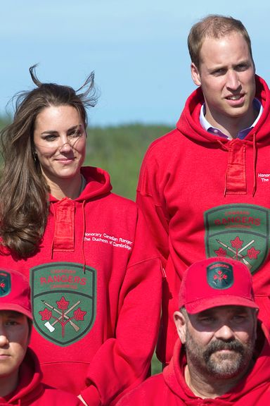 Britain’s Prince William and his wife Catherine, Duchess of Cambridge, wear the sweaters of the Canadian Rangers after being made honourary members during a visit to Blatchford Lake, Northwest Territories July 5, 2011. The Prince and his wife Catherine are on a royal tour of Canada from June 30 to July 8.   AFP PHOTO / POOL / Andy Clark (Photo credit should read ANDY CLARK/AFP/Getty Images)