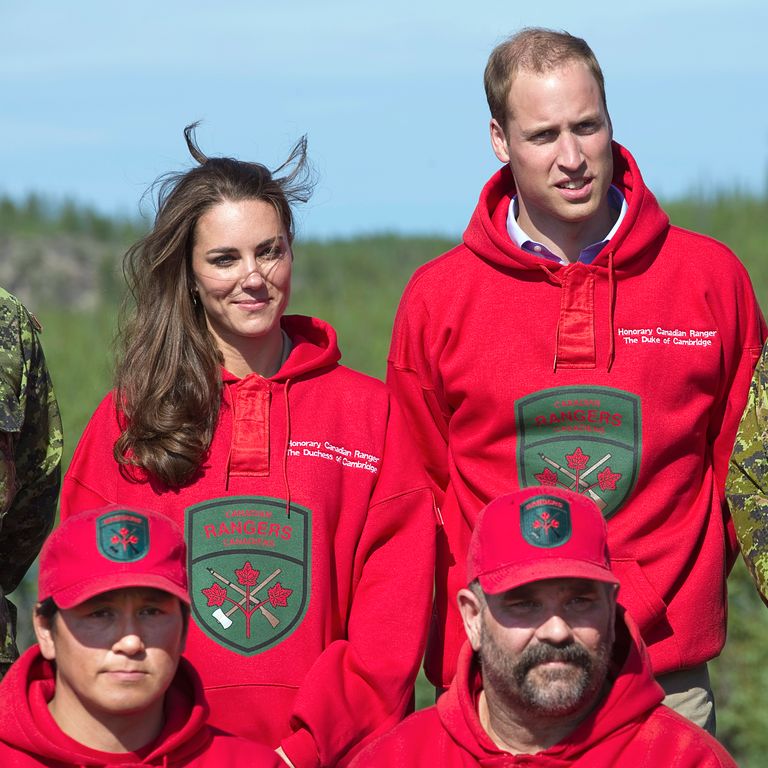 Britain’s Prince William and his wife Catherine, Duchess of Cambridge, wear the sweaters of the Canadian Rangers after being made honourary members during a visit to Blatchford Lake, Northwest Territories July 5, 2011. The Prince and his wife Catherine are on a royal tour of Canada from June 30 to July 8.   AFP PHOTO / POOL / Andy Clark (Photo credit should read ANDY CLARK/AFP/Getty Images)