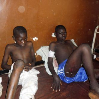 People are treated at the General hospital in Potiskum, Nigeria, Monday, Nov. 10, 2014, following a suicide bomb attack at Government Science Technical College Potiskum. Survivors say a suicide bomber disguised in a school uniform has detonated explosives at a high school assembly in northeast Nigeria, and a morgue worker says 48 students have been killed. 