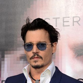 Actor Johnny Depp poses on arrival for the Los Angeles Premiere of the film 'Transcendence' on April 10, 2014 in Los Angeles, California. The film opens nationwide on April 18. AFP PHOTO/Frederic J. BROWN (Photo credit should read FREDERIC J. BROWN/AFP/Getty Images)