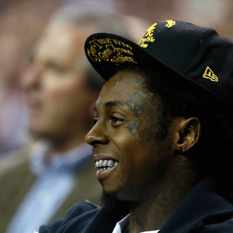 ATLANTA, GA - NOVEMBER 13: Rapper Lil Wayne watches the game between the Duke Blue Devils and the Kentucky Wildcats during the 2012 State Farm Champions Classic at Georgia Dome on November 13, 2012 in Atlanta, Georgia. (Photo by Kevin C. Cox/Getty Images)