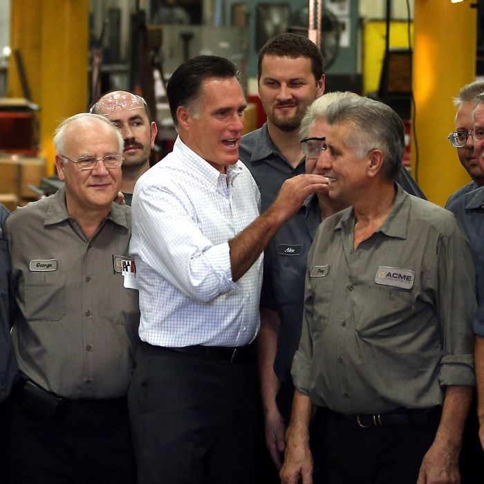 Republican presidential candidate and former Massachusetts Gov. Mitt Romney chats with workers during a campaign event at Acme Industries on August 7, 2012 in Elk Grove Village, Illinois.