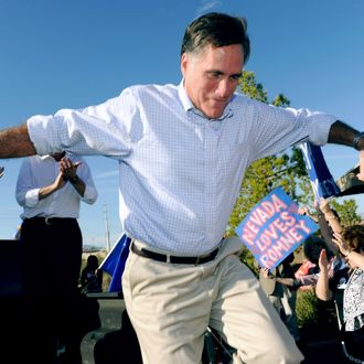 LAS VEGAS, NV - OCTOBER 17: Former Massachusetts Gov. and Republican presidential hopeful Mitt Romney jumps off the back of a pickup truck after speaking to supporters as he opens his Nevada campaign headquarters October 17, 2011 in Las Vegas, Nevada. Romney and six other presidential contenders will participate in a debate airing on CNN, sponsored by the Western Republican Leadership Conference in Las Vegas on October 18. (Photo by Ethan Miller/Getty Images)