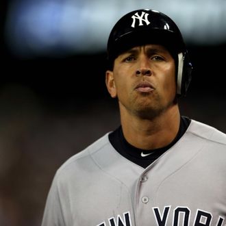 Alex Rodriguez #13 of the New York Yankees walsk off the field back to the dugout after he grounded out in the top of the 9th inning against the Detroit Tigers during game four of the American League Championship Series at Comerica Park on October 18, 2012 in Detroit, Michigan.