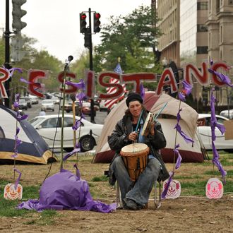 A man plays percussion during the Occupy DC carnival at McPherson Square in Washington on March 31, 2012. 