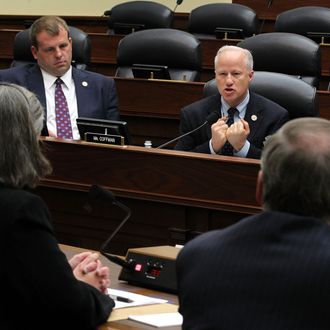 U.S. Rep. Mike Coffman (R-CO) (R) speaks as Rep. Jon Runyan (R-NJ) (L) listens during a hearing before the Oversight and Investigations Subcommittee of the House Armed Services Committee April 14, 2011 on Capitol Hill in Washington, DC.