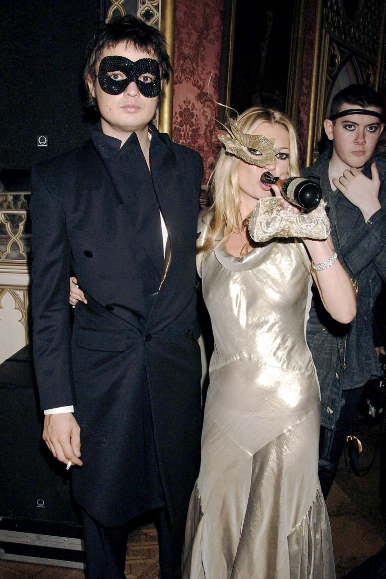 LONDON - OCTOBER 24:  (EMBARGOED FOR PUBLICATION IN UK TABLOID NEWSPAPERS UNTIL 48 HOURS AFTER CREATE DATE AND TIME) (ITALY OUT) Musician Pete Doherty and model Kate Moss wearing Philip Treacy masks attend the Moet & Chandon Fashion Tribute recognising those who have influenced the fashion world on an international level, at Strawberry Hill House in Twickenham on October 24, 2006 in London, England.  (Photo by Dave M. Benett/Getty Images)