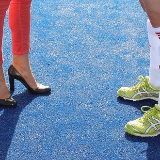A picture shows the shoes of Britain's Catherine, Duchess of Cambridge (L) and women's Team GB hockey captain Kate Walsh (R) as they talk during a visit by the duchess to the Riverside Arena at the Olympic Park in London on March 15, 2012.