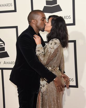 Kanye demonstrates how to test the ripeness of a grape. 