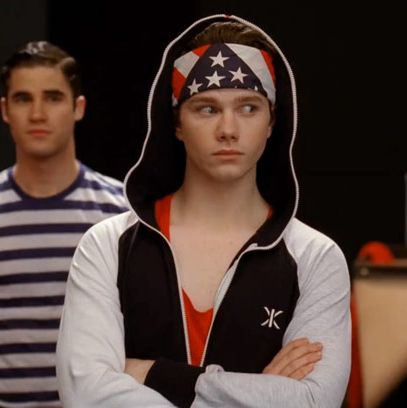 This is what we imagine Richard Simmons would design for the USA Gymnastics team. We further enjoy that this appears to be one of those hoodies that zips all the way around, and thus can completely seal itself, because then Kurt could really prank those football jerks by passing himself off as an innocent-looking gymbag. So James Bond.